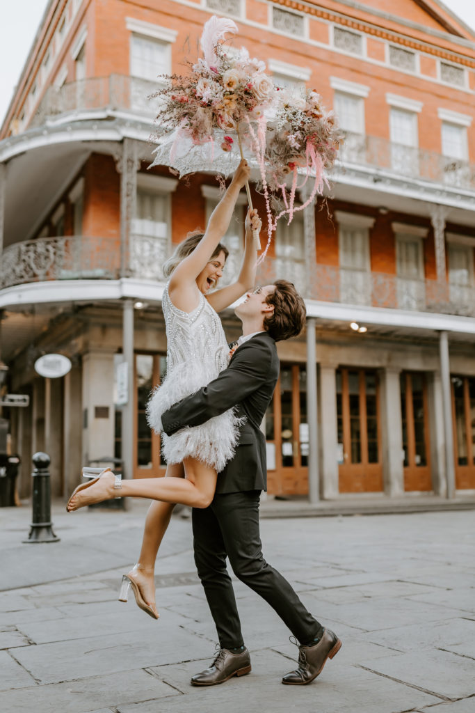happy couple modeling for a Great Gatsby inspired New Orleans elopement.