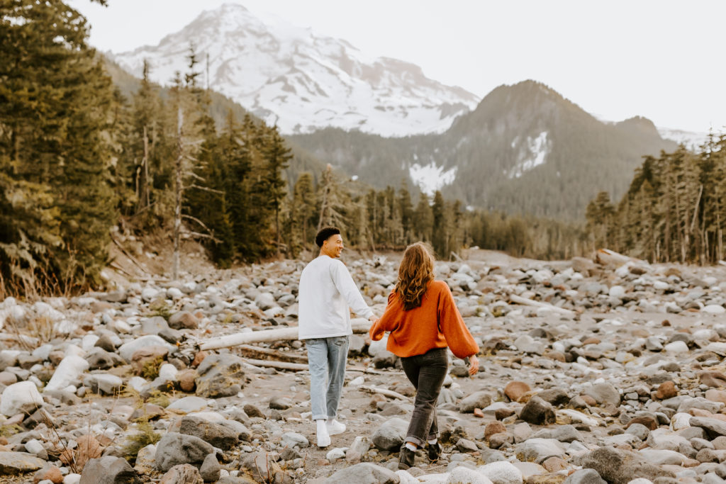 couple walking towards the mountain at the Mt. Rainier park