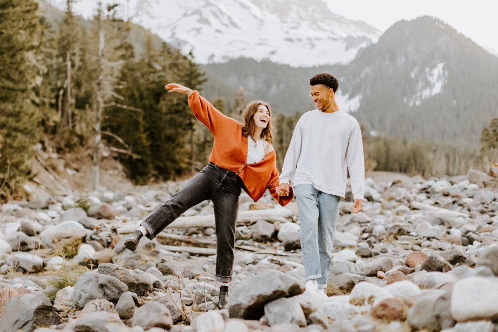 cute couple having fun at their engagement session at the Mt. Rainier park