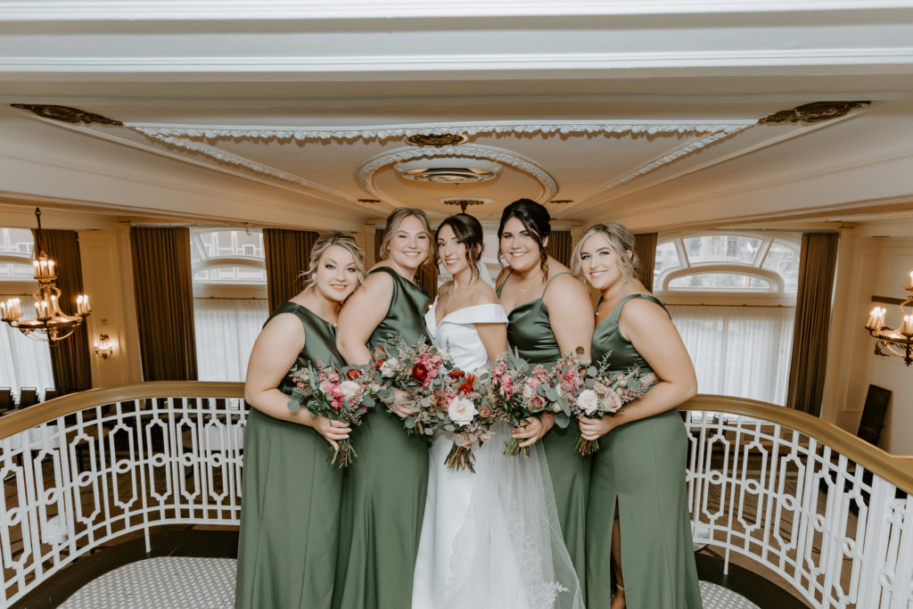 Bridal party girls in green dresses  at The Hotel Northland, Green Bay