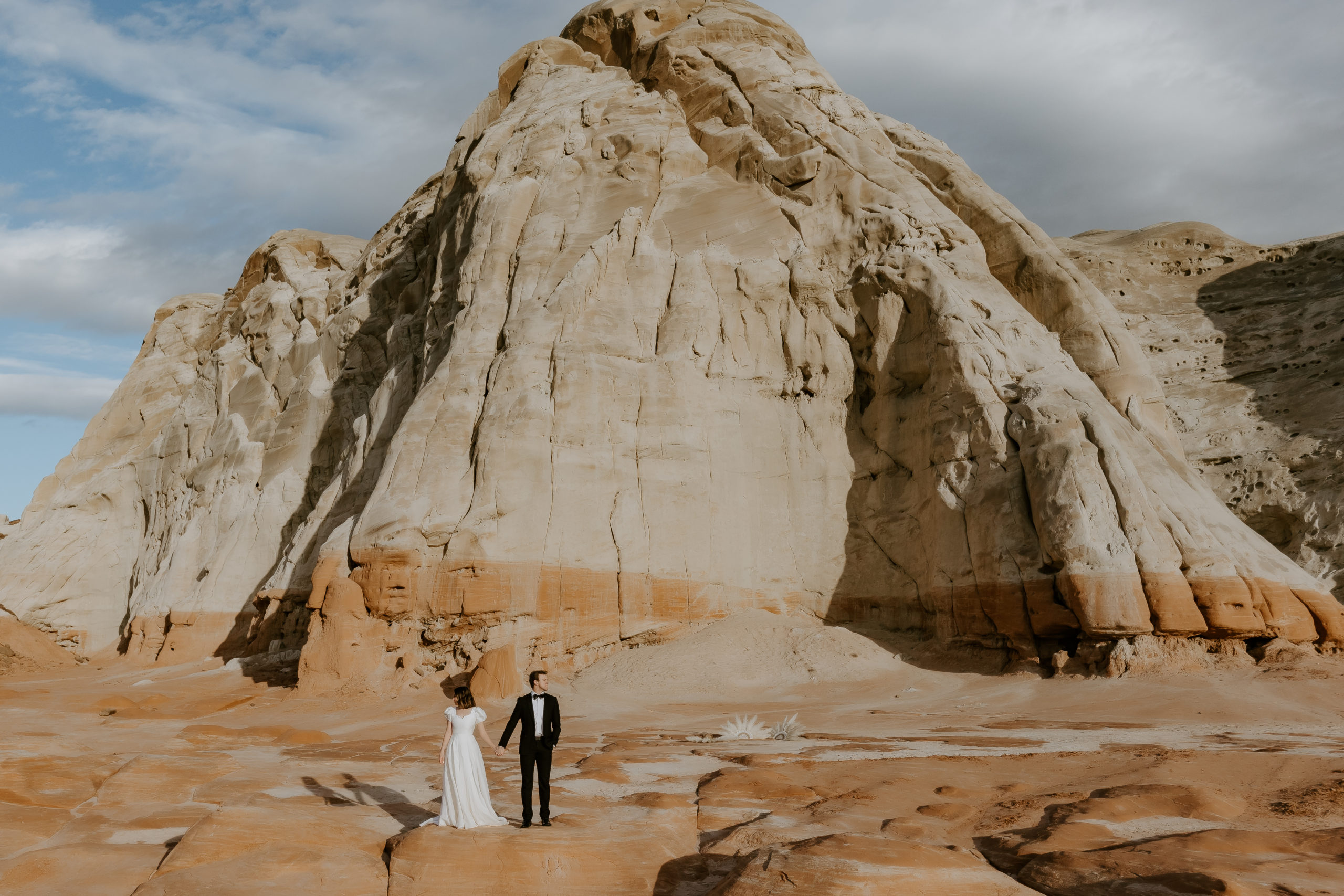 Elopement couple holding hands at the Toadstools in Utah