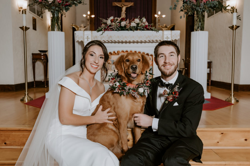 Bride and groom with their dog at the church