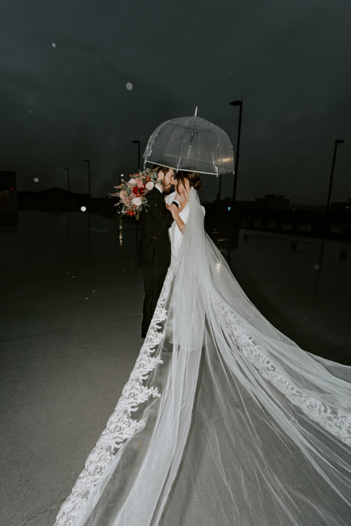 nighttime rainy wedding photos on the rooftop at The Hotel Northland, Green Bay 