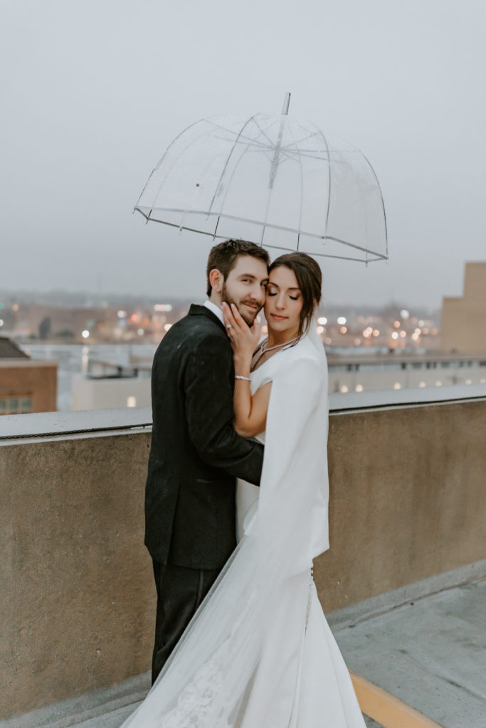 wedding couple under the umbrella on the rooftop at The Hotel Northland, Green Bay