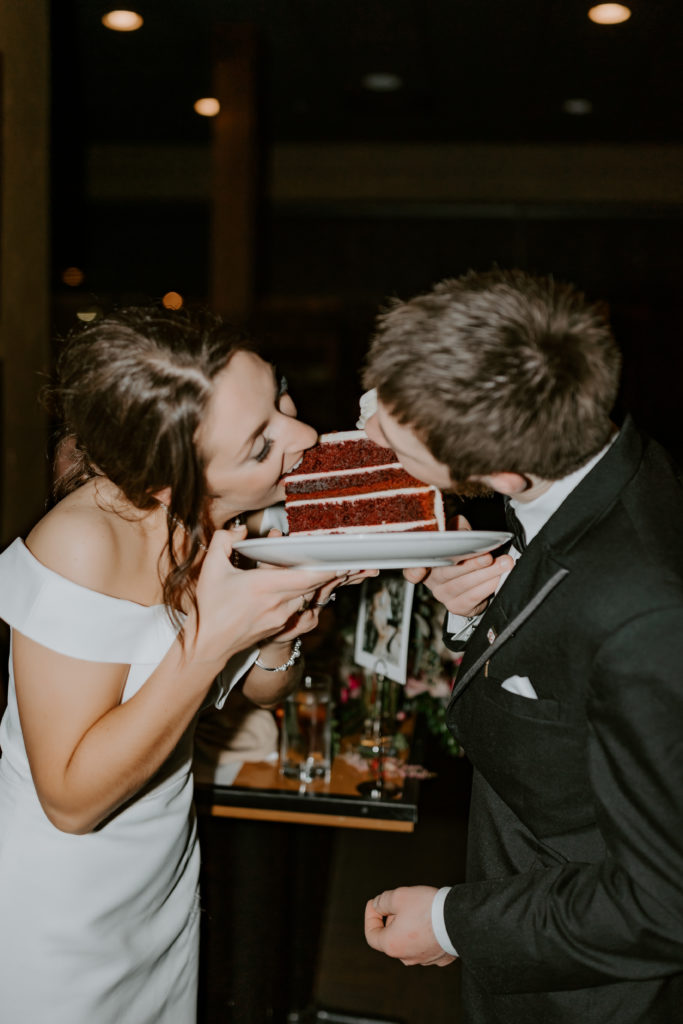 wedding couple eating their wedding cake 
