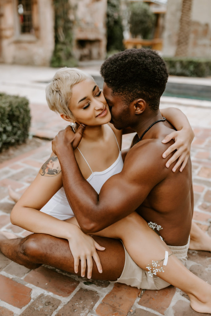 romantic black couple hugging each other 