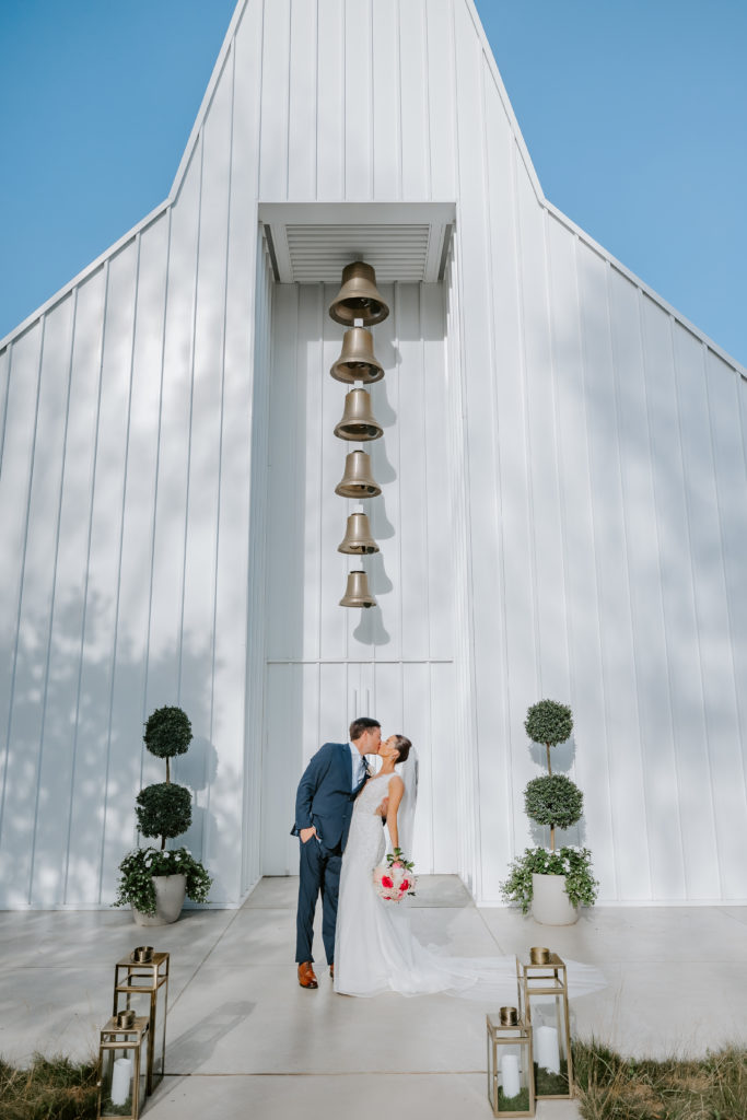 Wedding couple kissing at the Straits Chapel in Kohler  