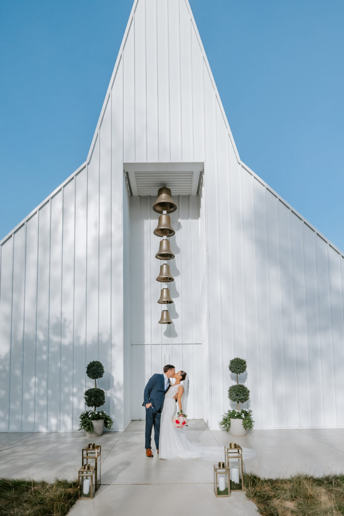 Wedding couple kissing at the Straits Chapel in Kohler  