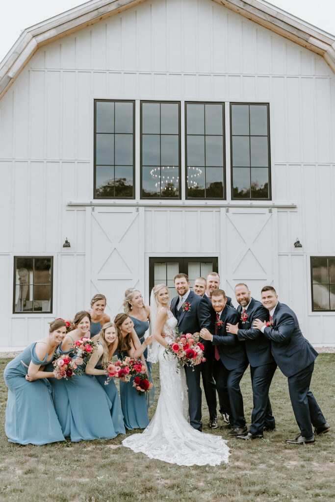 Bridal party having fun hugging at the Northern Haus in Door County